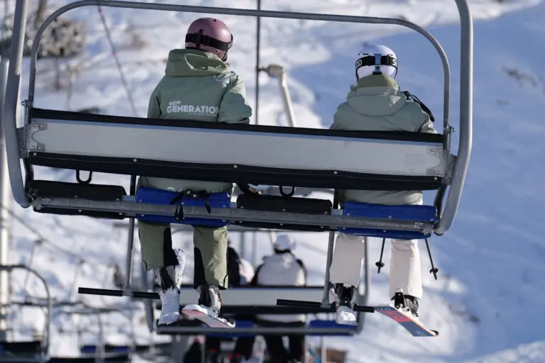 A New Generation Ski Instructor And A Nervous Skier On A Charlift