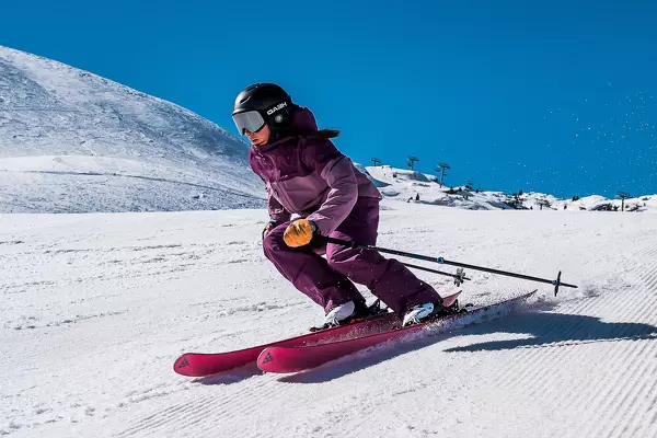 woman skiing parallel down a slope