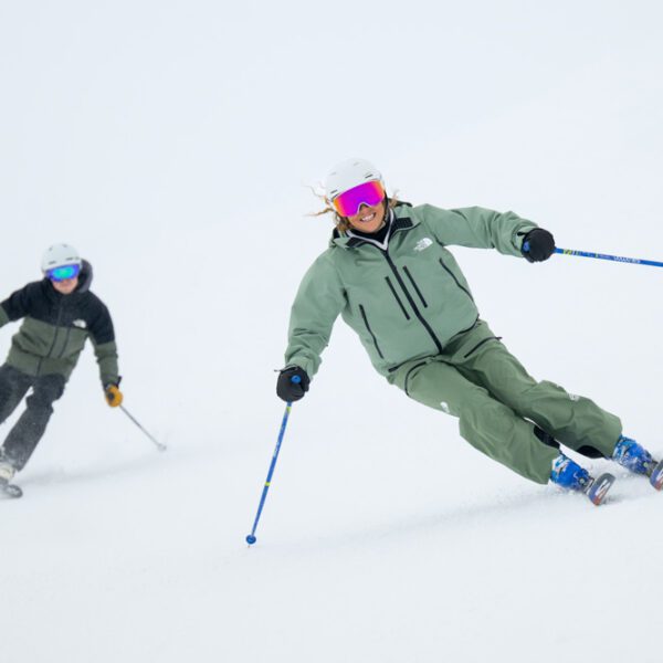 Skiers navigating a fresh snow