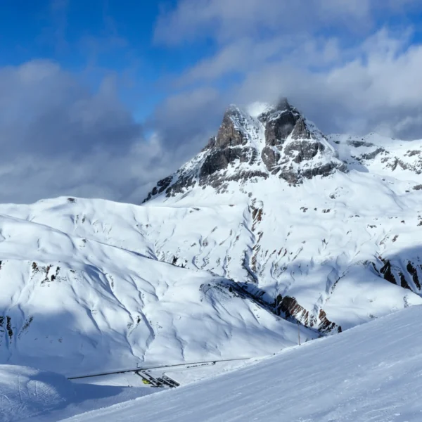 Snowy mountain landscape under blue sky