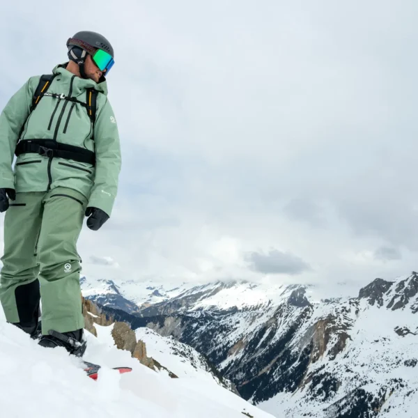 Snowboarder on snowy mountain peak