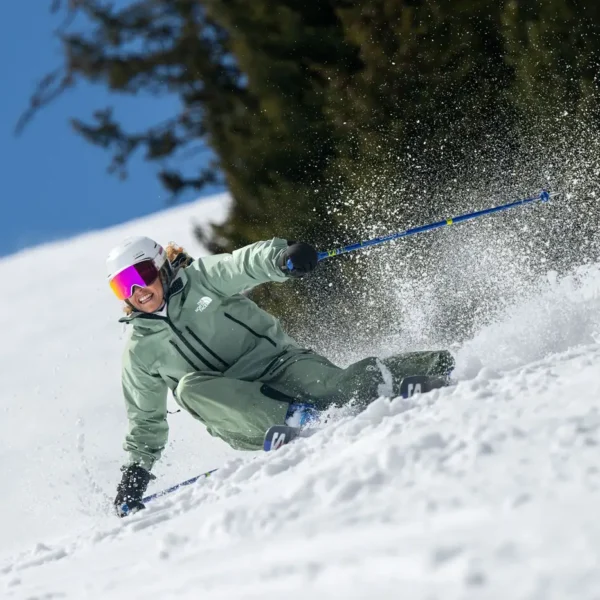 Person skiing on snowy slope.