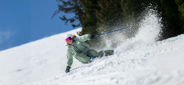 Person skiing on snowy slope.