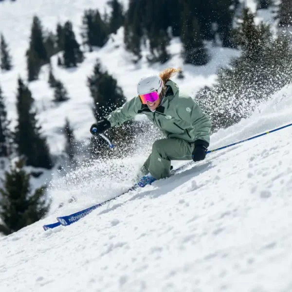 Skiing down a snowy slope.