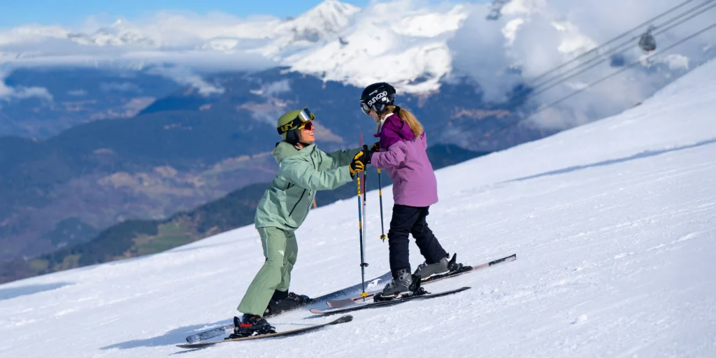 Beginner Snowploughing in a ski Lesson