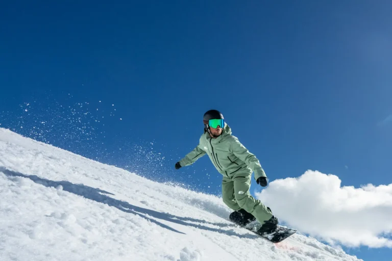 Snowboarder carving through fresh powder