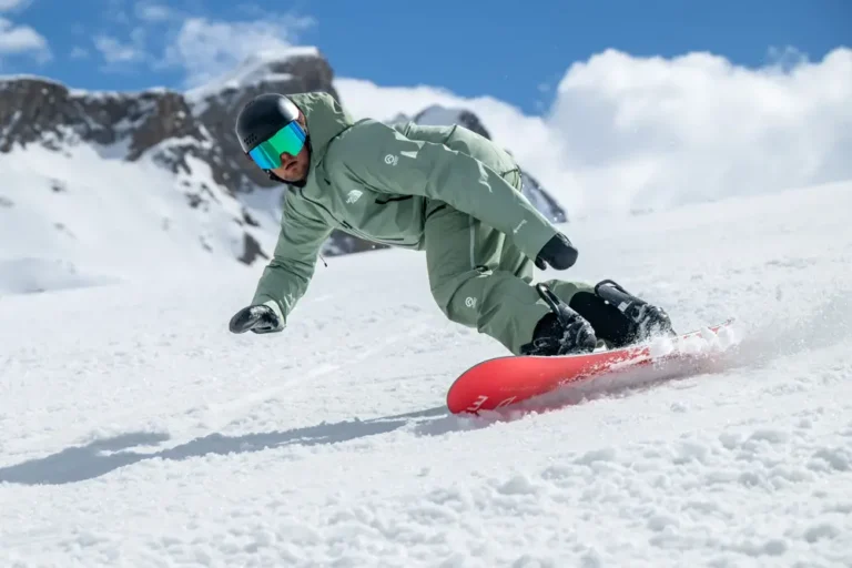 Snowboarder carving through fresh powder