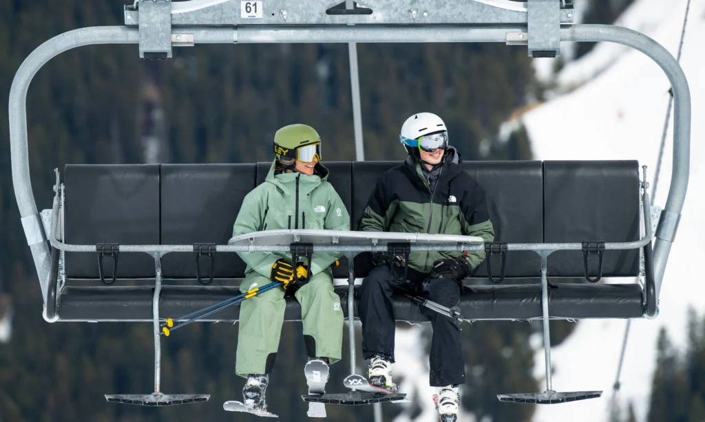 Ski Instructor and guest on chair lift