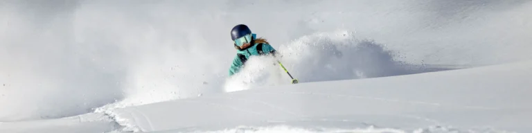 Skiing Off Piste In Deep Powder
