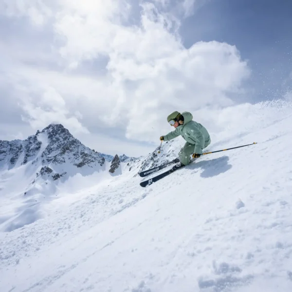 new generation ski instructor skiing in green uniform