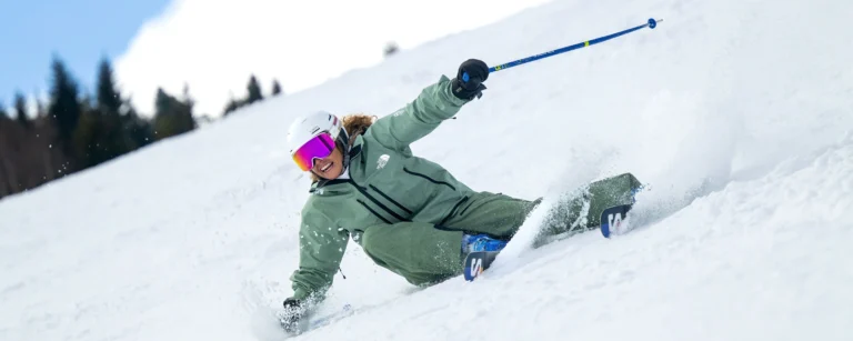 A New Generation Instructor Skiing Long Turns On Soft Snow