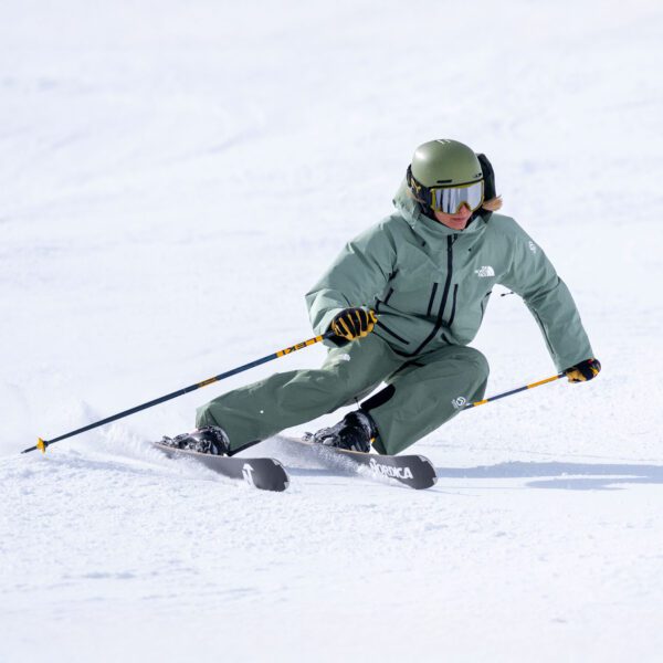 A Ski Instructor Doing A Right Footed Carving Turn