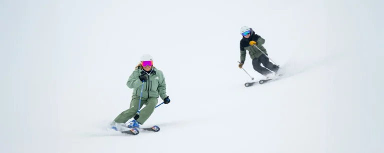 A New Generation Ski Instructor And A Trainee Skiing Basi Level 2 Steeps