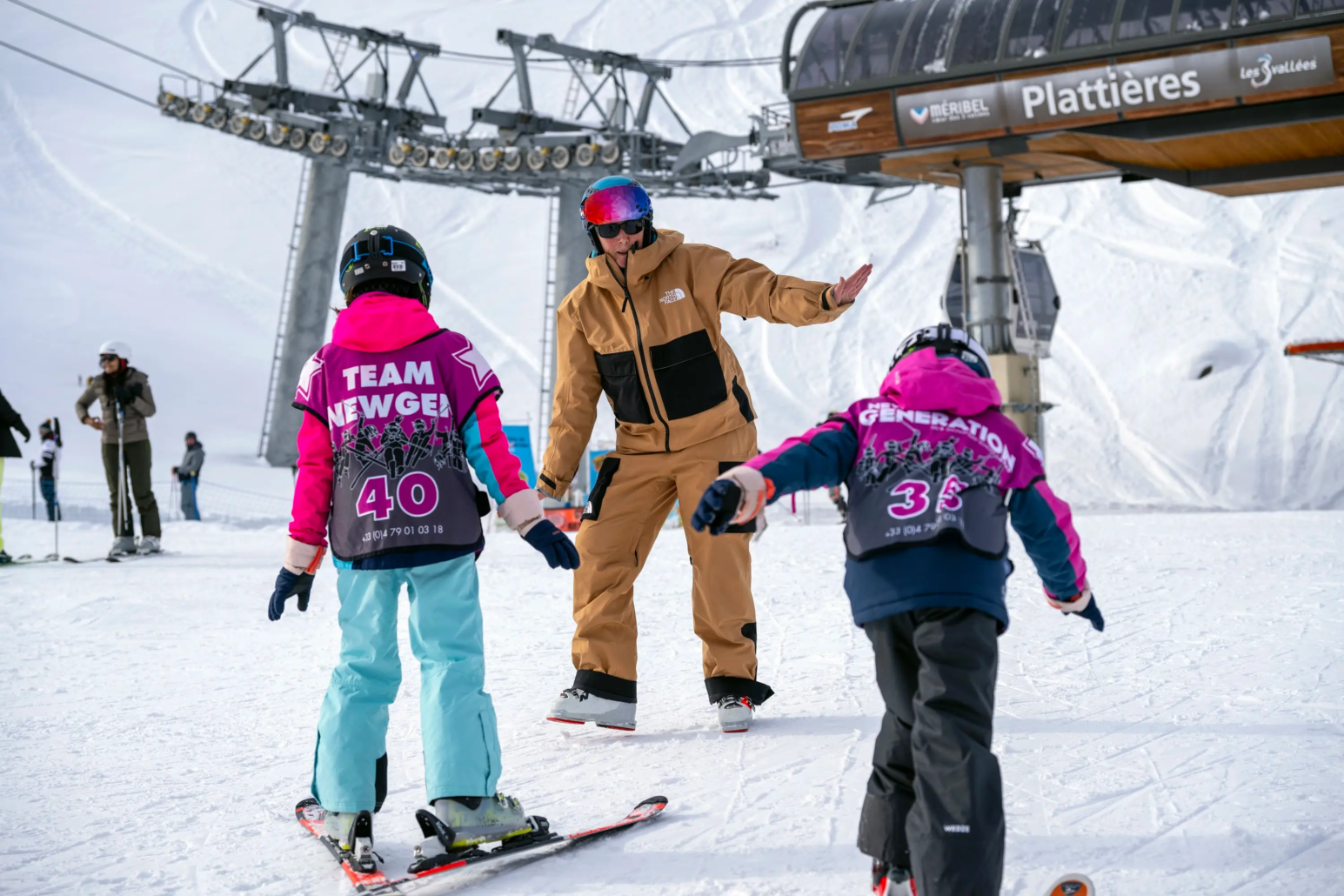 Children learning to ski in wallabies